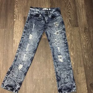 Ripped destresed blue and light blue jeans